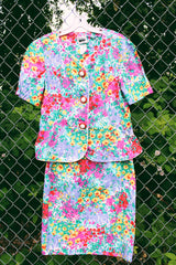 Women's vintage 1980's Leslie Fay matching set in an all over multicolored ditsy floral print. Short sleeve blazer jacket and midi pencil skirt.