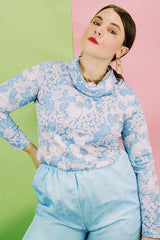 Women's vintage 1970's Graff Californiawear label long sleeve top with a cowl neck and all over blue floral print.