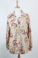Women's vintage 1970's Stephanie, K by Koret label long sleeve button up blouse with small dagger collar in tan color and all over pale pink paisley print.