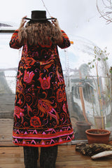 Women's vintage 1970's Dynasty label long sleeve long length velvet material puffy duster jacket in black, purple, and pink colors.