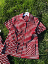 Women's vintage 1970's matching pant set with pants and a short sleeve button up shirt in maroon and white checkered print.