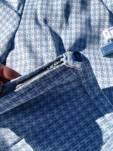 Women's vintage 1970's matching pant set with pants and button up shirt blouse in blue and white gingham polyester material.