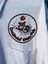 Women's or men's vintage 1970's short sleeve white polo t-shirt with half button closure and a graphic on the front left chest and one in the back.