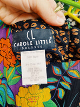 Women's vintage 1980's Carol Little label short sleeve midi length Summer dress with tropical floral print. Has a beaded wrap tie detail in the front.