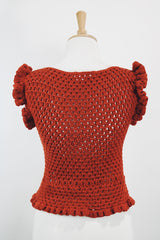 Women's vintage burnt orange acrylic crochet sweater top. Sleeveless with ruffles trim on shoulders. Has a short fit.