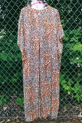 Women's vintage 1970's short sleeve maxi length muu muu kaftan dress in an all over leopard print in a polyester material.