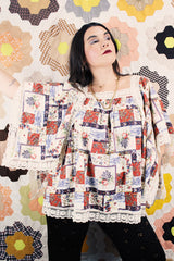 Women's vintage 1980's Lane Bryant label flutter sleeve blouse with cream lace trim and a square neckline. All over multicolored patchwork print.
