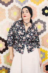 Women's vintage 1970's Ship N' Shore label short sleeve all over ditsy floral print blouse that buttons up the front and cinches at the waist.