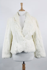 Women's vintage 1970's Wilsons Suede & Leather, Made in Korea label long sleeve bright white genuine fur coat with one hook and eye closure in the front.