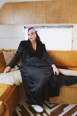 Women's vintage 1990's Blanche label long sleeve maxi length black wrap duster robe. Has lace and ruffle trim. Lightweight Polyester material.