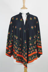 Women's vintage 1970's. Montgomery Ward label long sleeve black tunic blouse with a tie front neck and triangle shaped hem.