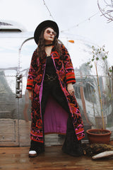 Women's vintage 1970's Dynasty label long sleeve long length velvet material puffy duster jacket in black, purple, and pink colors.