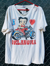 Women's or men's vintage 1980's Star California, Made in Chile label XL short sleeve white graphic t-shirt with Betty Boop on a motorcycle on the front.