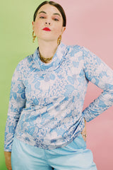 Women's vintage 1970's Graff Californiawear label long sleeve top with a cowl neck and all over blue floral print.