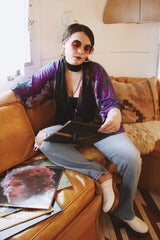 Women's vintage 1970's Cole of California label tie front blouse with balloon sleeves in purple, green, and orange colors and a lightweight polyester material.