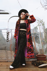 Women's vintage 1970's Dynasty label long sleeve long length velvet material puffy duster jacket in black, purple, and pink colors.