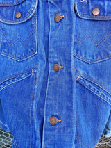 Women's vintage 1970's Wrangler, Made in USA long sleeve button up medium wash denim jacket with brass hardware and pockets.