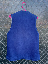 Men's or women's vintage 1970's sleeveless blue denim open front vest with cream shearling liner and pockets.