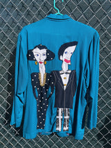 Women's vintage 1980's made in usa long sleeve blue blazer with one button closure and fully lined with large patches of people on front and back.