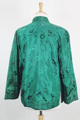 Women's vintage 1960's reversible long sleeve satin smoking jacket. Green on one side and cream on the other. Fabric buttons.