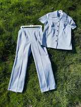 Women's vintage 1970's matching pant set with pants and button up shirt blouse in blue and white gingham polyester material.