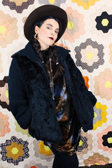 Women's vintage 1980's Luh - London, Paris, New York label long sleeve zip up jacket in black with genuine fir body and ribbed knot arms. Balloon shaped arms.