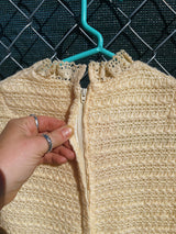 Women's vintage 1970's Maggi label long sleeve short length cream colored crochet dress with lace trim and mock neck.