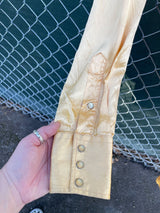 Men's vintage 1950's H Bar C Ranchwear, Long Tail label long sleeve western shirt in satin yellow color with pearly snap buttons.