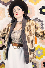 Women's vintage 1960's Hopper Furs, St. Louis label long sleeve open front cardigan jacket with all over patchwork multicolored fur and a rib knit trim.