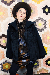 Women's vintage 1980's Luh - London, Paris, New York label long sleeve zip up jacket in black with genuine fir body and ribbed knot arms. Balloon shaped arms.