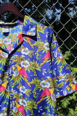 Men's vintage 1990's Island Shirtworks label short sleeve button up Hawaiian print shirt in blue with all over parrot print in a lightweight Polyester material.