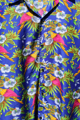 Men's vintage 1990's Island Shirtworks label short sleeve button up Hawaiian print shirt in blue with all over parrot print in a lightweight Polyester material.