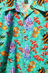 Men's vintage 1980's CPR ZIN, USA label short sleeve button up Hawaiian print shirt in turquoise with an all over fish print in a cotton material.