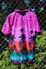Men's vintage 1990's Island Shirtworks short sleeve button up Hawaiian print shirt in lightweight polyester material in purple, blue, and red with palm trees.