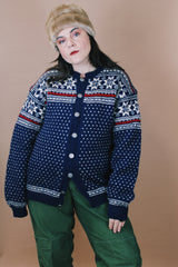 Women's or men's vintage 1970's Norway Handknitted label size large navy blue Norwegian style button up wool cardigan with all over white and red print