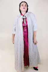 Women's vintage 1970's I. Magnin, Odette Barsa label long length short sleeve baby blue cream lace duster robe jacket with ribbon trim and peter pan collar.