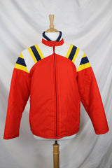 Men's or women's vintage 1980's JCPenney, Made in Hong Kong label long sleeve zip up puffy jacket in nylon material and red, blue, white, and yellow colors.