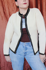 Women's vintage 1960's Brentwood Sportswear label long sleeve zip up cardigan in a waffle knit cream color. Has black and tan trim throughout.