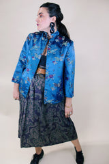 Women's vintage 1960's long sleeve vibrant blue satin robe jacket with a mandarin collar and overall ditsy print.