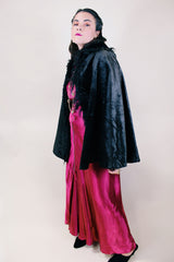 Women's vintage possibly 1940's black colored pony fur large cape poncho with fur trim around the edges. Has a closure at the neck and the peter pan collar and fully lined.
