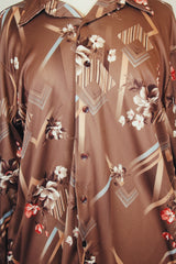 Men's vintage 1970's Montgomery Ward label long sleeve light brown colored button up shirt with all over floral print.