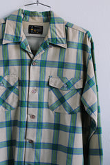 Men's vintage 1970's Towncraft, Penneys label long sleeve button up plaid shirt in tan color with blue and green plaid print. Chest pockets.