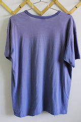 Women's or men's vintage 1970's Russell Athletic label short sleeve blue t-shirt with yellow graphic on the front.