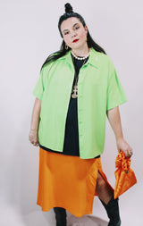 Women's vintage 1980's Collection by Shirq, New York, Made in USA label short sleeve bright lime green button up blouse with collar and shiny trim in a lightweight poly material.