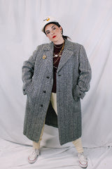 Men's vintage 1970's Metropole Monarch, Man's Shop San Francisco label long length long sleeve black and cream wool chevron trench coat with brown wood buttons.