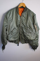 Men's or women's army zip up bomber jacket with long sleeves. Army green color with orange satin liner. Reversible.