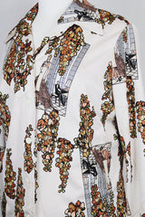 Women's vintage 1970's matching novelty print sleeveless tank top and button up blouse with dagger collar. All over novelty print in white and brown colors.