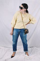 Men's or women's vintage 1960's Pringle label long sleeve pullover sweater in lambswool material. Butter yellow color and all over cable knit texture.