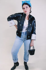 Women's vintage 1960's satin reversible robe jacket in black and grey with all over embroidered print. Mandarin collar and fabric buttons.