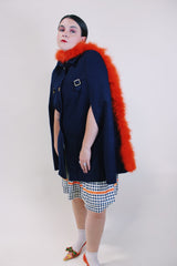 Women's vintage 1960's navy blue wool material poncho with slits for arms, gold hardware and gold buttons. Fully lined.